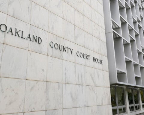 Michigan woman pleads no contest to abuse after 3 kids are found living alone for years