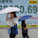 Asian shares sink, with Tokyo down nearly 5% as slumping AI stocks drag world markets lower