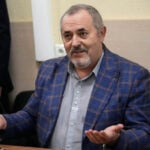 A Putin critic is convicted on charges that will keep from campaigning for Russia's parliament