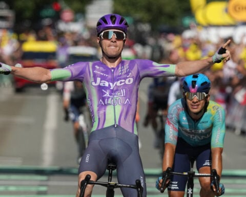 Schmid wins long 13th stage of the Tour and Pogacar safely keeps overall lead