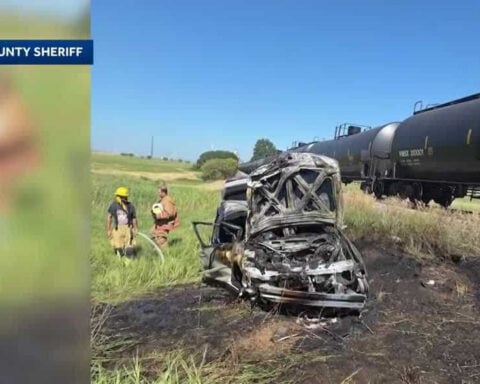 Man pulls teenage brothers from burning car after train crash