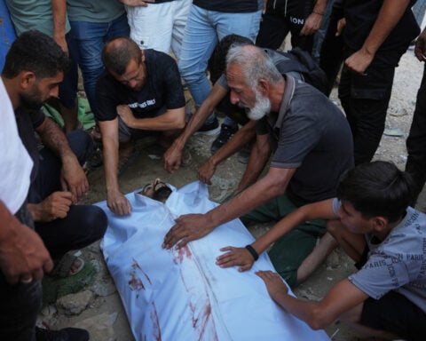 An Israeli strike on a funeral in Gaza kills 7 people and wounds 22, a local hospital says