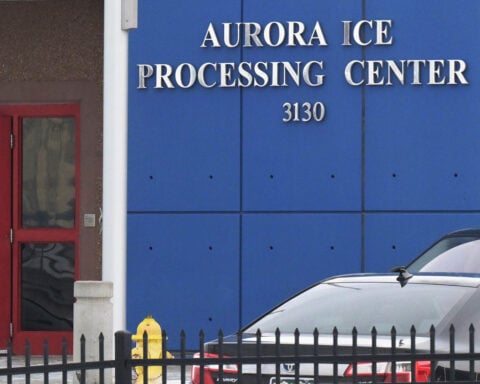 Off-duty employee arrested in shooting near ICE detention center in Colorado that injured a woman