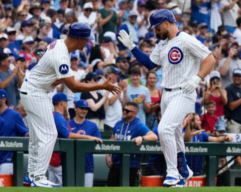 Former Cubs player Anthony Rizzo snares Michael Busch's home run ball in the Wrigley Field bleachers