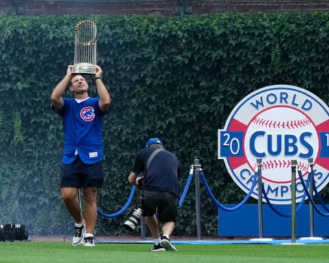 Former Cubs player Anthony Rizzo snares Michael Busch's home run ball in the Wrigley Field bleachers