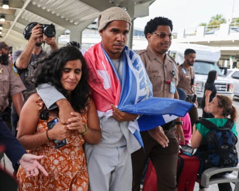 Cuban artist and dissident exiled from country after 5 years in prison arrives in U.S.