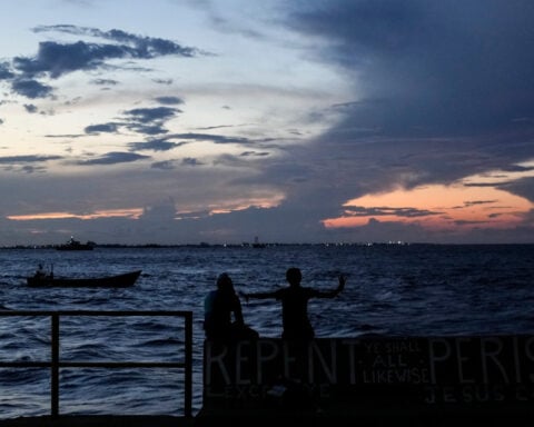A ferry carrying 133 people capsizes off Guyana's coast, leaving dozens missing