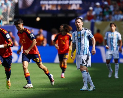 Soccer-Spain battle past 10-man Argentina 1-0 in extra time to win World Cup 