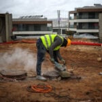 Portugal's migrant curbs hit construction firms working to solve housing crisis