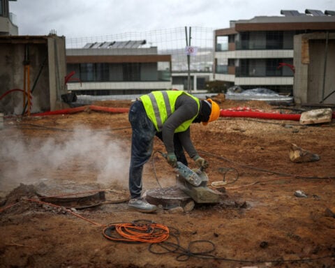 Portugal's migrant curbs hit construction firms working to solve housing crisis