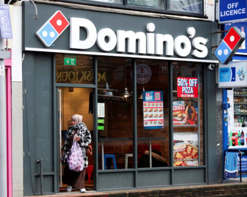 Domino's holds annual sales forecasts as value-seeking diners pressure growth