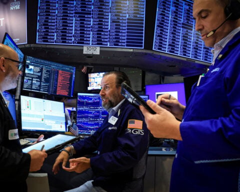 Wall St opens higher as chips recover, megacap earnings loom