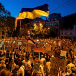 Ukraine's Zelenskiy meets commanders as street protests mount
