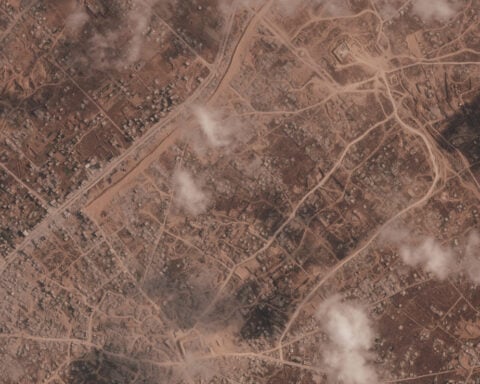 Israel is building a miles-long earthen barrier inside Gaza, entrenching its division