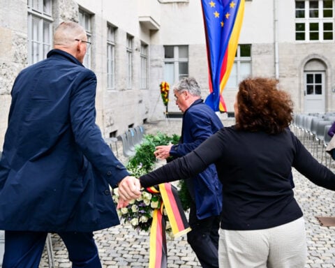 Descendant of Nazi opponent tries to remove far-right party's wreath at Hitler plot memorial event