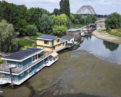 Stranded houseboats and grounded cruise ships: Europe’s rivers are shrinking amid heat and drought