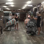 How one barbershop is helping the daughter left behind after deadly flood