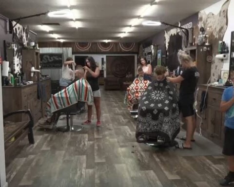How one barbershop is helping the daughter left behind after deadly flood