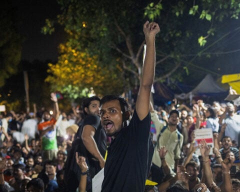 Thousands protest in India after clashes, despite Modi assuring action on exams