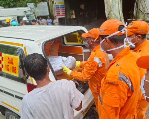 Toxic gas slows efforts to rescue 13 workers trapped in India hydropower tunnel