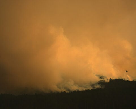 Firefighters battle one of Spain's biggest-ever wildfires during heat wave across the Mediterranean