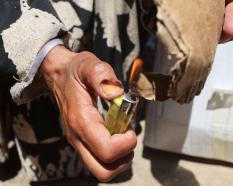 In Gaza's tent camps, a cigarette lighter becomes a lifeline