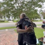 Neighbors kick open door to save sleeping couple from fire