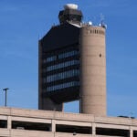 Two planes nearly collided in Boston after a false alarm and a controller forgot who he cleared for takeoff, the NTSB reports