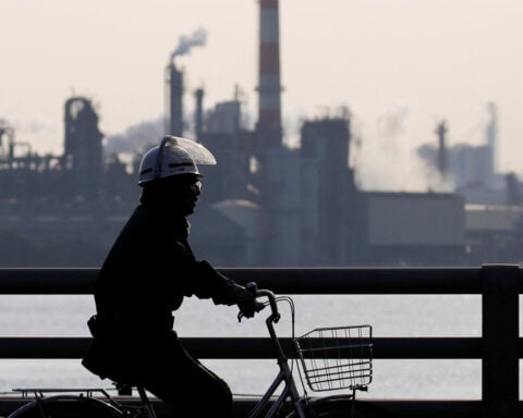 Japan's factory activity stays firm as output surges in July, PMI shows