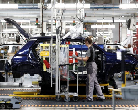 Euro zone business activity returns to growth in July for first time in four months, PMI shows