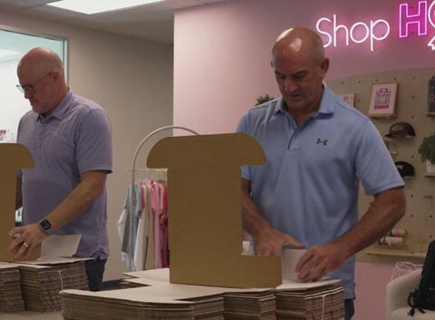 Volunteers pack thousands of Hope Kits for women battling breast cancer