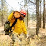 Oregon firefighters brace for windy and hot weather as they battle dozens of blazes