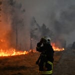 Macron calls crisis meeting as monster wildfires drive 250,000 from their homes