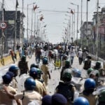 India suspends policeman for firing AK-47 at student protesters