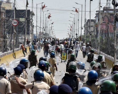 India suspends policeman for firing AK-47 at student protesters