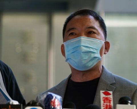 Former Hong Kong opposition leader Wu granted stay in Britain, lawyer says