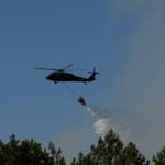 Firefighters in France hold back vast wildfire as heat returns to test their grip