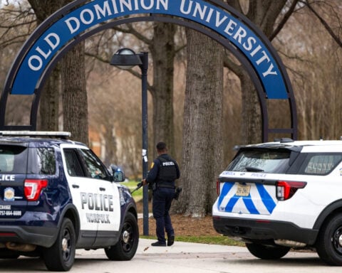 Virginia university didn't know of student's conviction before campus shooting, report says