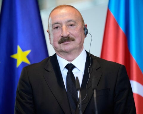 Azerbaijan court convicts 9 journalists and activists in a case seen as an attack on media freedom