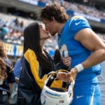 A ring before a playoff win for Justin Herbert, who gets engaged to singer Madison Beer