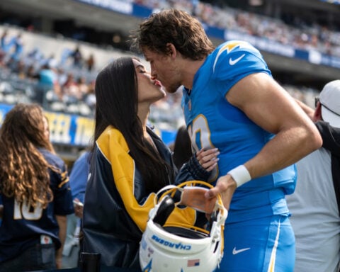 A ring before a playoff win for Justin Herbert, who gets engaged to singer Madison Beer