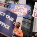 Trump's attacks on mail balloting and concerns over delays turn midterms spotlight on Postal Service