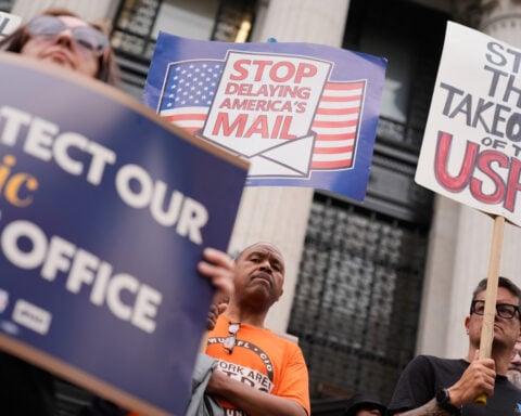 Trump's attacks on mail balloting and concerns over delays turn midterms spotlight on Postal Service
