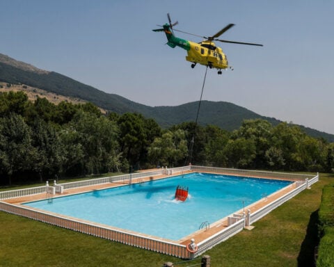 Firefighters in Spain battle the country's largest blaze ever recorded
