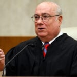 Judge weighs bid to block or reverse transfers of transgender inmates into a segregated prison unit