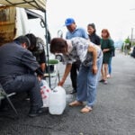 Japan's earthquake leaves communities thirsting for water and relief from heat