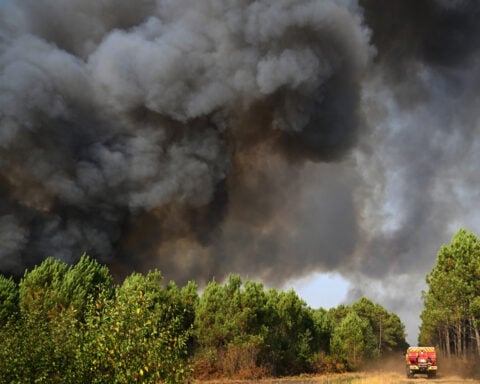 Tens of thousands of French wildfire evacuees allowed to return home as cooler weather moves in