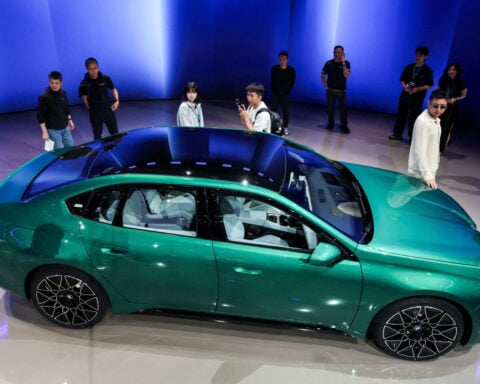 China slump hits BMW's earnings, prompting restructuring call