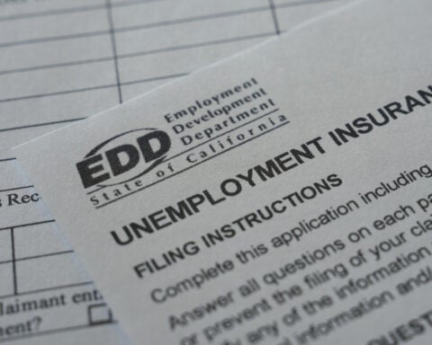 US filings for jobless benefits rise to 197,000 last week, but layoffs remain historically low