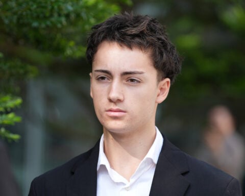 French student pleads guilty and is fined for a straw-licking stunt in Singapore